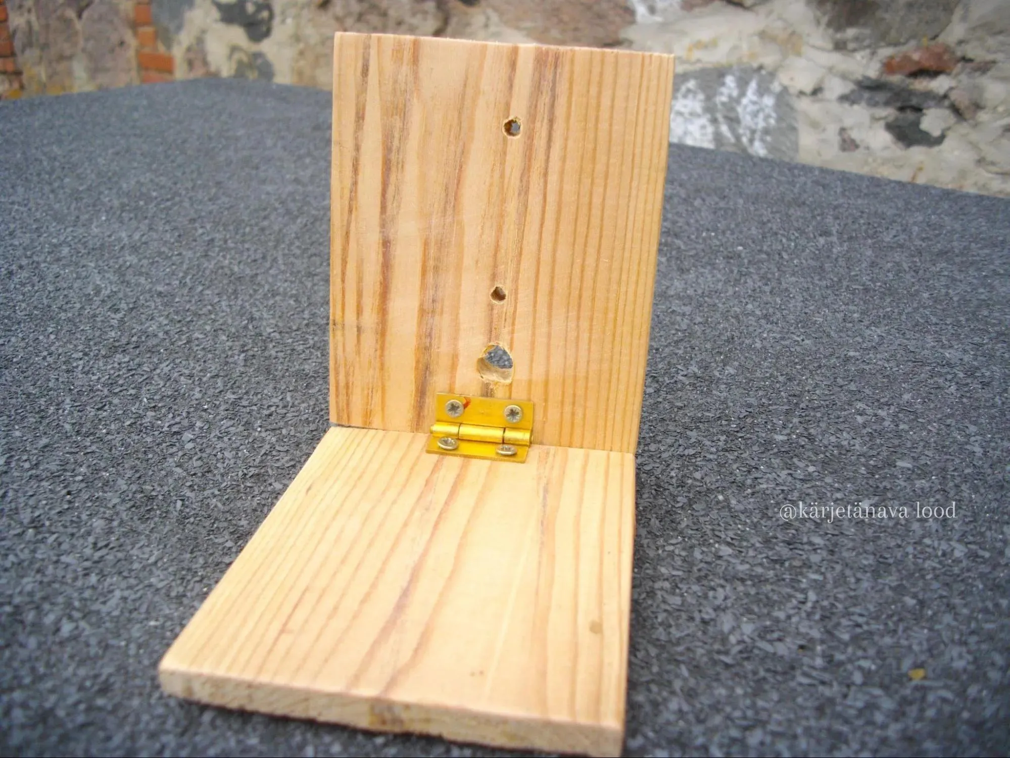 Air hole and bolt holes in the smoker's bellows boards